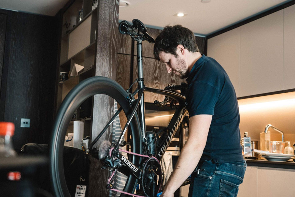 Brown checking the gears on a race bike